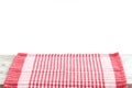 Empty wooden desk table and red checked tablecloth over mint wallpaper background Royalty Free Stock Photo