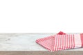 Empty wooden desk table and red checked tablecloth over mint wallpaper background Royalty Free Stock Photo