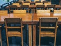 Wooden dining table set near the green garden Royalty Free Stock Photo