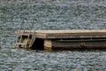 Empty wooden floating platform with metal container as floating body on a lake, due to the corona virus all bathing facilities Royalty Free Stock Photo