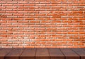 Empty wooden floor. Brick wall background Royalty Free Stock Photo