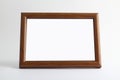 Empty wooden frame for painting, picture or text on white wood background. Wooden blank picture frame use for products display iso