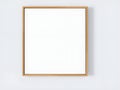 Empty Wooden Frame on White Wall, Minimalist Art Display Royalty Free Stock Photo