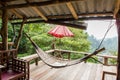 Empty wooden hammock outside the terrace