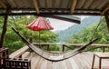 Empty wooden hammock outside the terrace