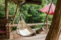 Empty wooden hammock outside the terrace