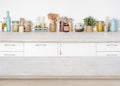 Empty wooden kitchen table on blurred background of food ingredients Royalty Free Stock Photo