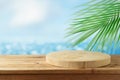 Empty wooden log on rustic table over blurred sea beach background.  Summer mock up for design and product display Royalty Free Stock Photo