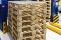 empty wooden pallets stacked in a warehouse Royalty Free Stock Photo