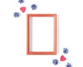 Empty wooden photo frame, red shapes in the form of hearts, blue bows are on a white background. Composition for Valentine`s Day. Royalty Free Stock Photo