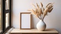 Empty Wooden Picture Frame. Framework. Vase with pampas grass.