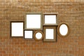 Empty wooden picture frames on brick wall Royalty Free Stock Photo