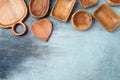 Empty wooden plate, boards and trays on dark background. Kitchen utensils concept. Top view, flat lay