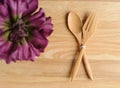 empty wooden plate with fork and flower decorate Royalty Free Stock Photo