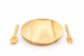 Empty wooden plate and spoons, forks.