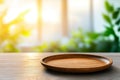 Empty wooden plate on table with blurred background of greenery and sunlight warm tones of wood create serene and inviting Royalty Free Stock Photo