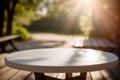 Empty wooden round table for product display with blurred garden background. Ai generative Royalty Free Stock Photo