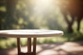 Empty wooden round table for product display with blurred garden background. Ai generative Royalty Free Stock Photo