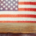 Empty wooden rustic table over USA flag bokeh background. USA national holidays background. 4th of July celebration. Royalty Free Stock Photo