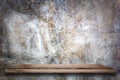 Empty wooden shelf with bare concrete background. Royalty Free Stock Photo