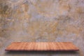 Empty wooden shelf with bare concrete background. Royalty Free Stock Photo