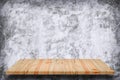 Empty wooden shelf with bare concrete background. Royalty Free Stock Photo