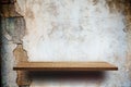 Empty wooden shelves on cracked brick wall Royalty Free Stock Photo
