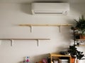 Empty wooden shelves with white bracket on the wall in the house
