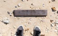 Empty wooden signboard against tropical sand beach Royalty Free Stock Photo