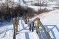 Empty Wooden Staircase Covered in Snow in a Park Royalty Free Stock Photo