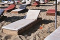 Empty wooden sun loungers on the beach