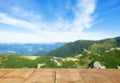 Empty wooden surface and beautiful view of mountain landscape on sunny day. Space for design Royalty Free Stock Photo