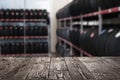 Wooden surface and blurred view of car tires in auto store, closeup. Space for text