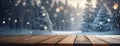 An empty wooden surface in the foreground with a blurred winter forest scene in the background, snowflakes gently Royalty Free Stock Photo