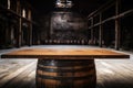 empty wooden table against the backdrop of a huge whiskey hangar Royalty Free Stock Photo