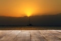 Empty wooden table against background ocean sunset product display montage