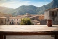 Empty wooden table on a backdrop of small traditional Italian town. Product display template Royalty Free Stock Photo