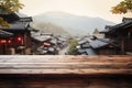 Empty wooden table on a backdrop of small traditional Japanese town. Product display template