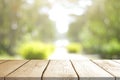 Empty wooden table with Blurred image of abstract circular green bokeh from nature style background