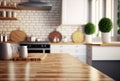 Empty wooden table and blurred kitchen white wall background Wood table top on blur kitchen counter Royalty Free Stock Photo