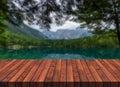 Empty Wooden Table with Blurred Mountain Lake on Background Royalty Free Stock Photo