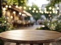 Empty Wooden Table in Blurred Outdoor Cafe Setting Royalty Free Stock Photo