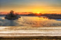 Empty wooden table with blurred picteresque winter background