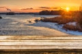 Empty wooden table with blurred picteresque winter background