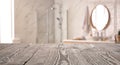 Empty wooden table and blurred view of bathroom interior Royalty Free Stock Photo