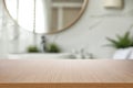 Empty wooden table and blurred view of bathroom interior Royalty Free Stock Photo