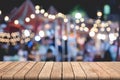 Empty wooden table of brown on front blurred colorful background, for presentation and advertising product and template