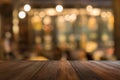 Empty wooden table of brown in front Warm orange color of bokeh