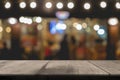 Empty wooden table of brown in front Warm orange color of bokeh on wooden Royalty Free Stock Photo