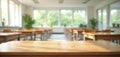 Empty wooden table classroom interior, sunlight creates blurred background. Class desks rows, windows green trees. Classroom with Royalty Free Stock Photo
